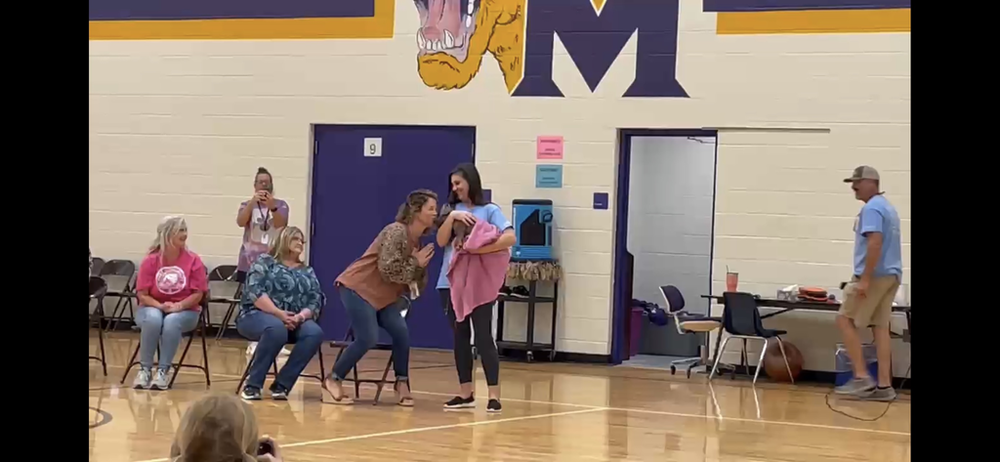 MES Raises $532.32 and Mrs. Stone Kisses the Pig